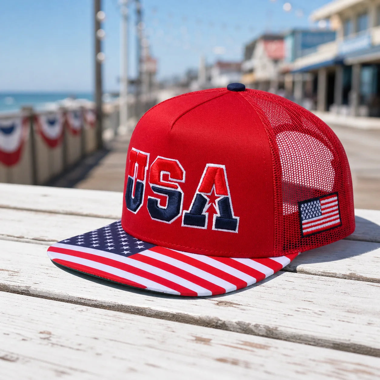 Man wearing the exact HAVINA WHOLESALE red USA trucker hat at a seaside cookout